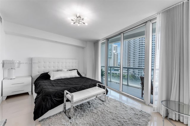 495 Brickell Ave Unit Bay1007, Miami, FL 33131 - bedroom featuring expansive windows and access to exterior