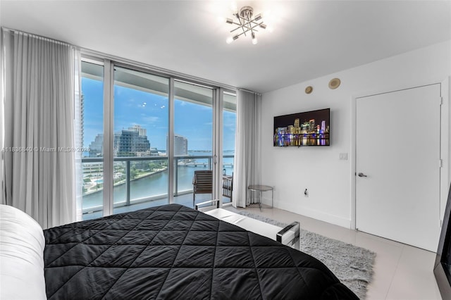 495 Brickell Ave Unit Bay1007, Miami, FL 33131 - bedroom with expansive windows, access to exterior, and tile patterned floors