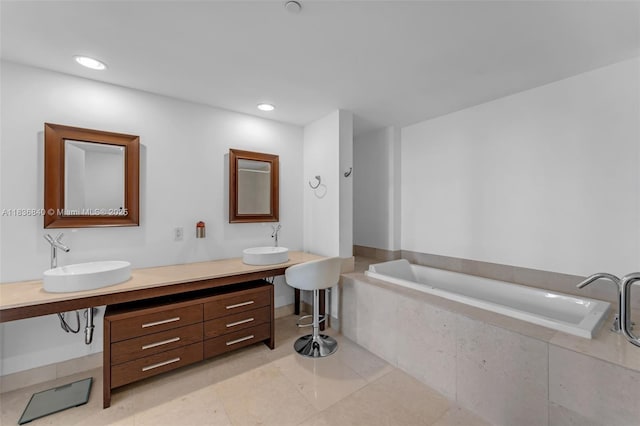 495 Brickell Ave Unit Bay1007, Miami, FL 33131 - full bathroom with double vanity, a bath, tile patterned flooring, and recessed lighting