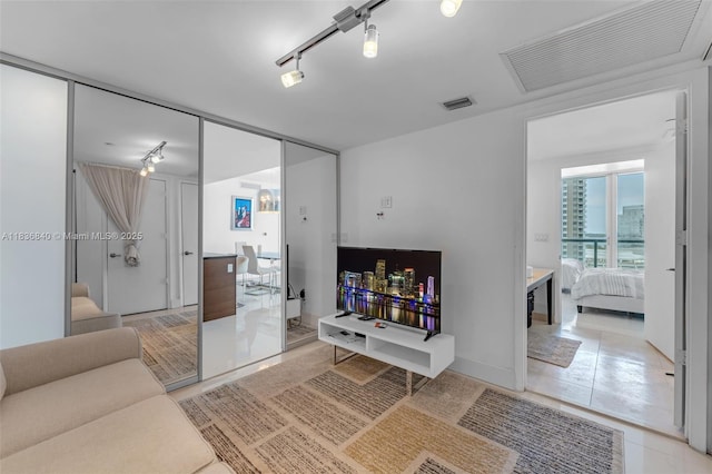 495 Brickell Ave Unit Bay1007, Miami, FL 33131 - living area featuring rail lighting and light tile patterned floors