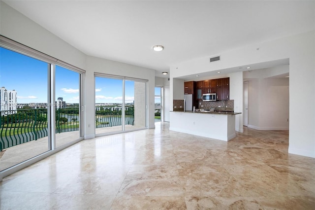20000 E Country Club Dr Unit Ts02, Aventura, FL 33180 - unfurnished living room with a water view and baseboards
