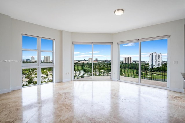 20000 E Country Club Dr Unit Ts02, Aventura, FL 33180 - unfurnished room featuring a view of city, finished concrete flooring, and plenty of natural light