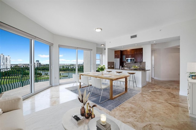 20000 E Country Club Dr Unit Ts02, Aventura, FL 33180 - dining area with a water view and baseboards