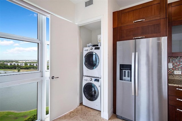 20000 E Country Club Dr Unit Ts02, Aventura, FL 33180 - laundry area featuring stacked washer / drying machine