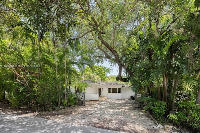 4050 Loquat Ave, Coconut Grove, FL 33133 - obstructed view of property with stucco siding