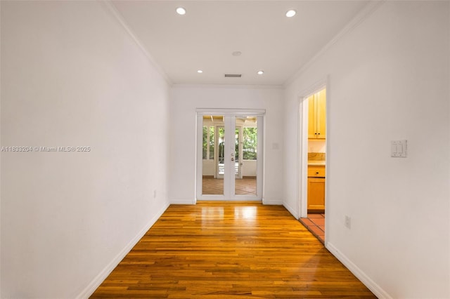 4050 Loquat Ave, Coconut Grove, FL 33133 - corridor with french doors, crown molding, light wood-style flooring, and recessed lighting
