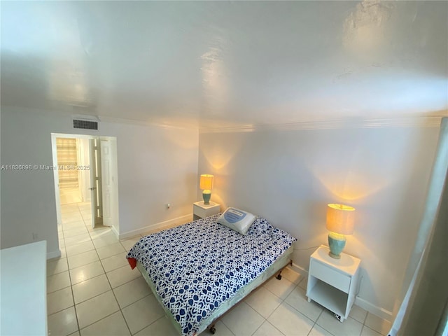 6900 N Kendall Dr Unit A102, Pinecrest, FL 33156 - bedroom with light tile patterned floors and crown molding