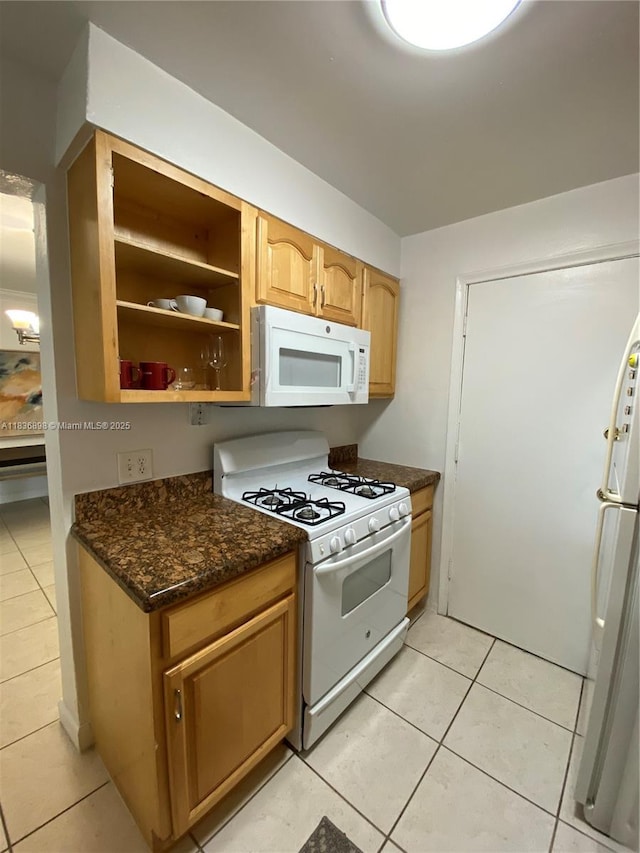 6900 N Kendall Dr Unit A102, Pinecrest, FL 33156 - kitchen featuring white appliances, light tile patterned floors, dark stone countertops, and open shelves