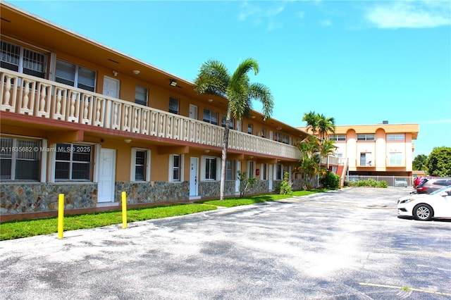 1154 W 35th St Unit 221, Hialeah, FL 33012 - view of property featuring uncovered parking