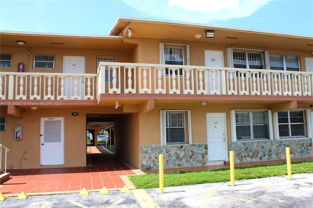 1154 W 35th St Unit 221, Hialeah, FL 33012 - view of building exterior with uncovered parking