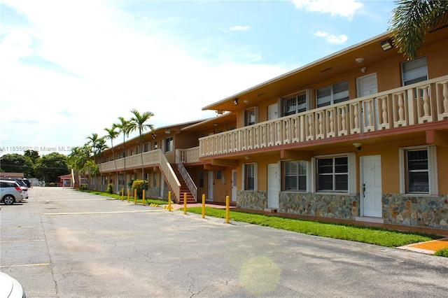 1154 W 35th St Unit 221, Hialeah, FL 33012 - view of building exterior with uncovered parking
