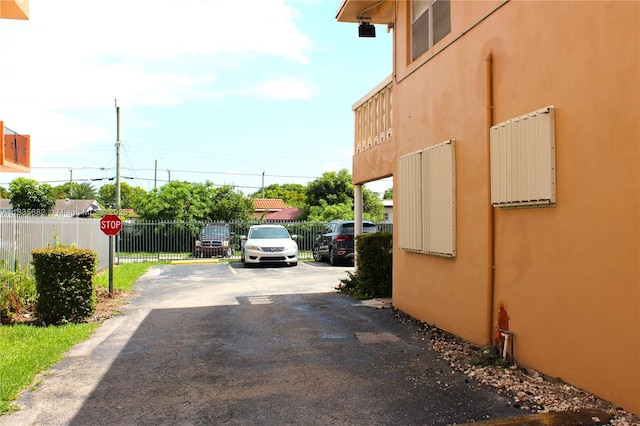 1154 W 35th St Unit 221, Hialeah, FL 33012 - view of asphalt road featuring traffic signs
