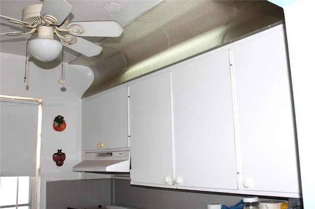 1154 W 35th St Unit 221, Hialeah, FL 33012 - kitchen with under cabinet range hood, a ceiling fan, and white cabinets