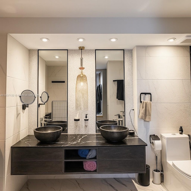 20379 W Country Club Dr Unit 2333, Aventura, FL 33180 - full bathroom featuring marble look tile flooring, double vanity, and recessed lighting