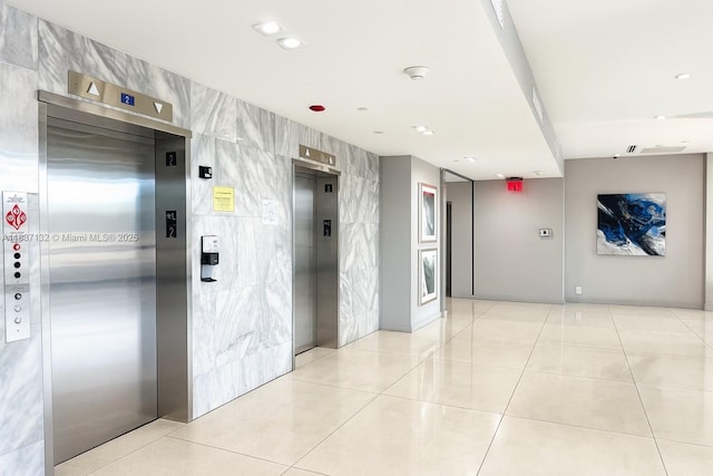 20379 W Country Club Dr Unit 2333, Aventura, FL 33180 - building lobby with tile walls and recessed lighting