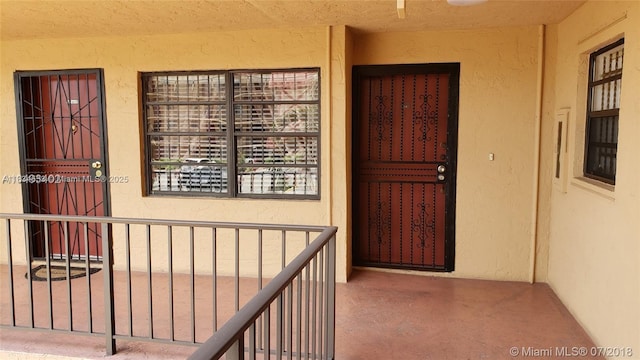 1325 W 68th St Unit 214, Hialeah, FL 33014 - entrance to property with stucco siding