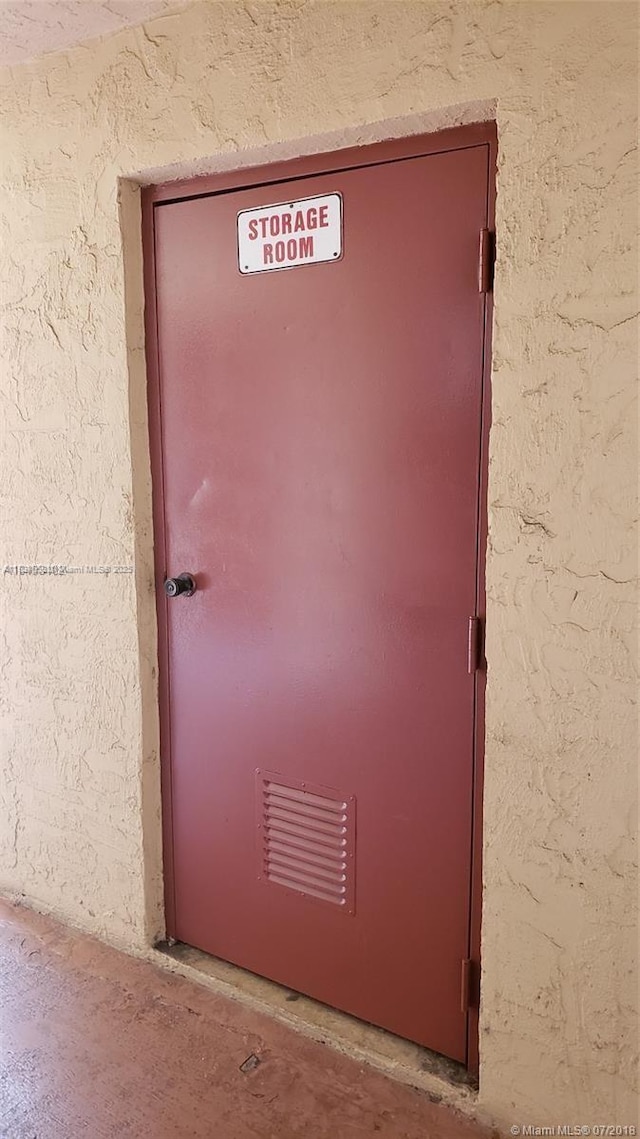 1325 W 68th St Unit 214, Hialeah, FL 33014 - property entrance featuring stucco siding
