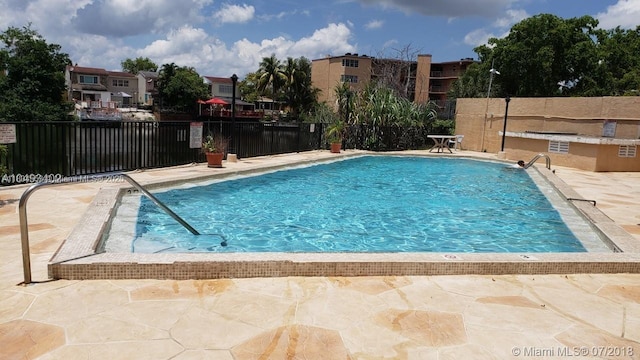 1325 W 68th St Unit 214, Hialeah, FL 33014 - community pool featuring a patio area