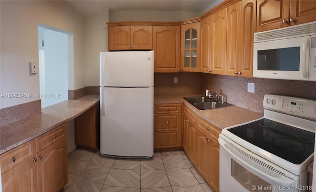 1325 W 68th St Unit 214, Hialeah, FL 33014 - kitchen featuring white appliances, glass insert cabinets, and light tile patterned flooring