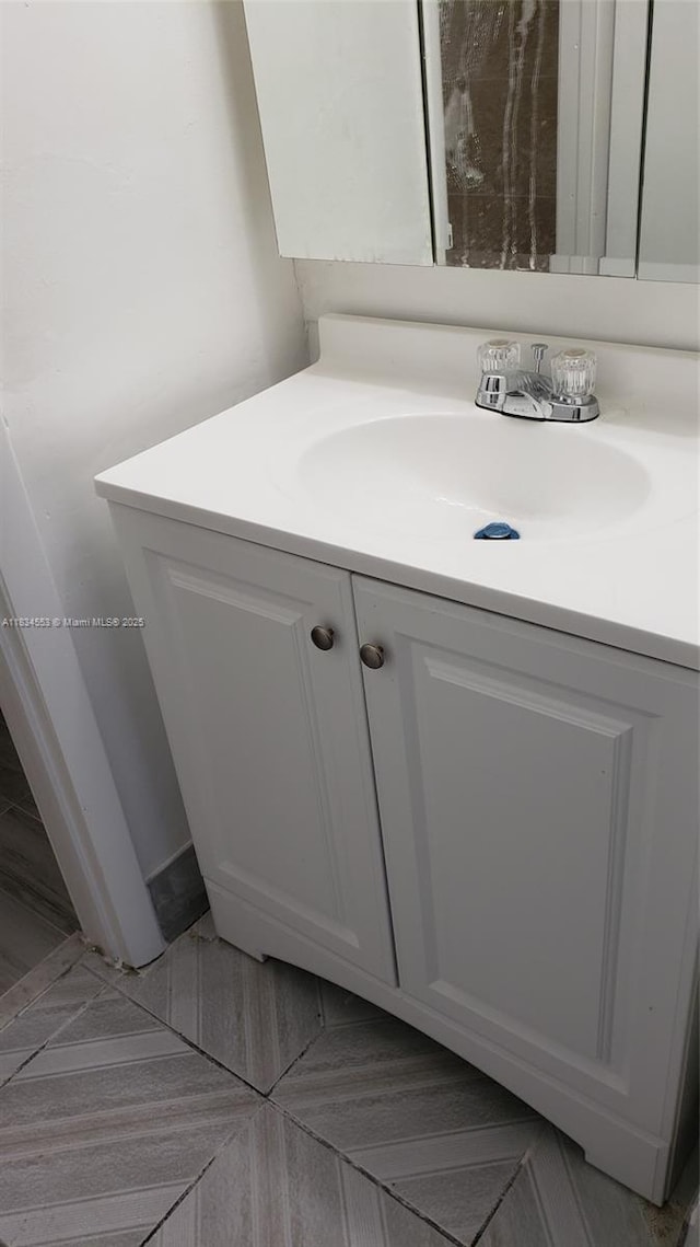 1325 W 68th St Unit 214, Hialeah, FL 33014 - bathroom featuring vanity and tile patterned flooring