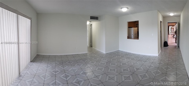 1325 W 68th St Unit 214, Hialeah, FL 33014 - spare room featuring baseboards
