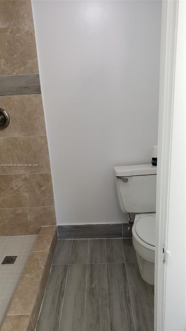 1325 W 68th St Unit 214, Hialeah, FL 33014 - bathroom with a shower stall and toilet
