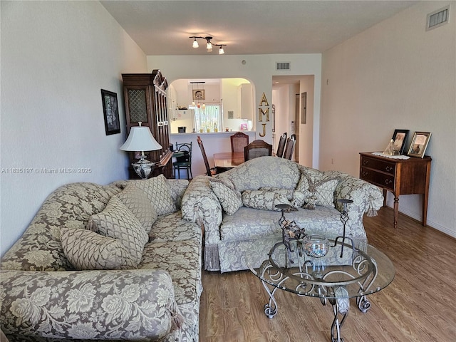 7611 Southampton Ter Unit 102, Tamarac, FL 33321 - living area with arched walkways and wood finished floors