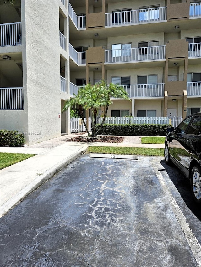 7611 Southampton Ter Unit 102, Tamarac, FL 33321 - view of apartment building / complex with uncovered parking