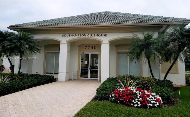 7611 Southampton Ter Unit 102, Tamarac, FL 33321 - property entrance featuring stucco siding and a tile roof