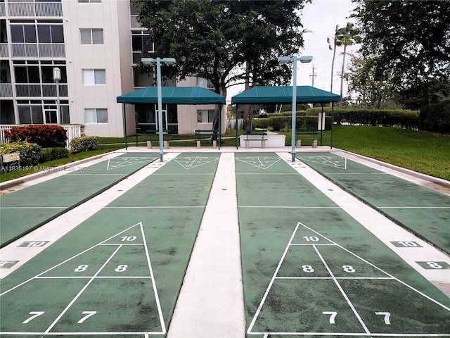 7611 Southampton Ter Unit 102, Tamarac, FL 33321 - view of community featuring a lawn and shuffleboard
