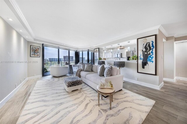 4000 Towerside Ter Unit 1507, Miami, FL 33138 - living area featuring light wood finished floors and ornamental molding