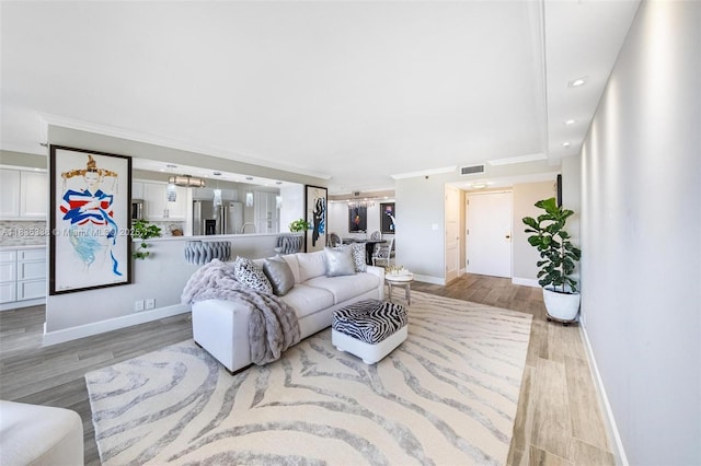 4000 Towerside Ter Unit 1507, Miami, FL 33138 - living area with light wood-style floors, ornamental molding, and recessed lighting