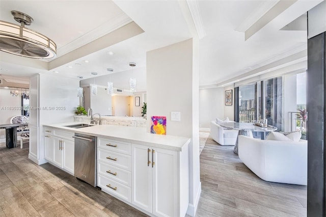 4000 Towerside Ter Unit 1507, Miami, FL 33138 - kitchen with dishwasher, crown molding, light wood finished floors, white cabinetry, and pendant lighting
