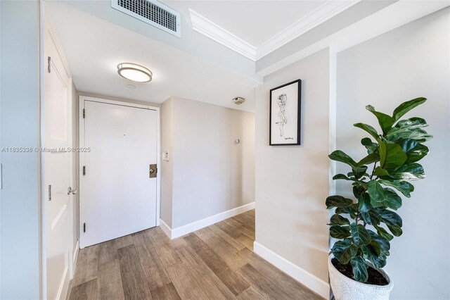 4000 Towerside Ter Unit 1507, Miami, FL 33138 - entrance foyer with crown molding and light wood finished floors