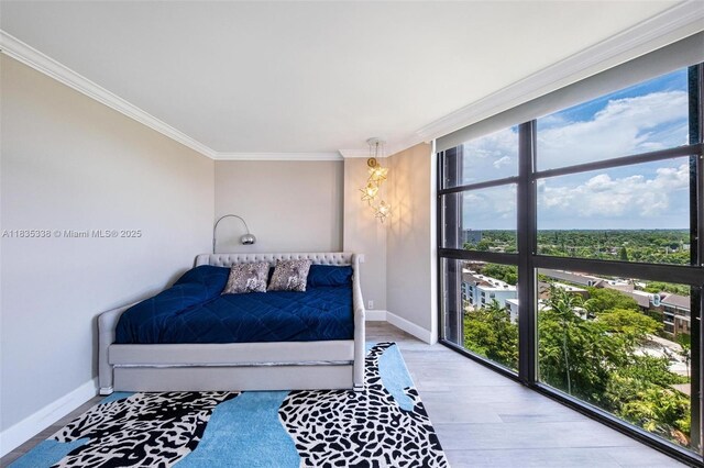 4000 Towerside Ter Unit 1507, Miami, FL 33138 - bedroom featuring ornamental molding, multiple windows, and wood finished floors