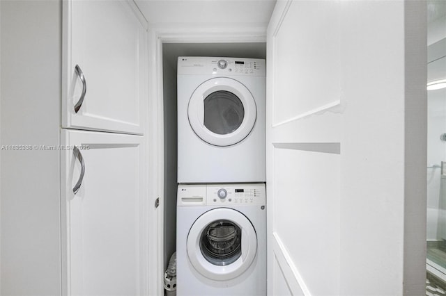 4000 Towerside Ter Unit 1507, Miami, FL 33138 - laundry area with estacked washer and dryer
