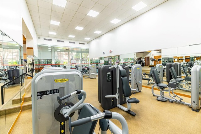4000 Towerside Ter Unit 1507, Miami, FL 33138 - exercise room with a paneled ceiling and a towering ceiling