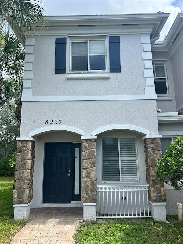 8297 SW 25th Ct Unit 101, Miramar, FL 33025 - view of front of house featuring stone siding and stucco siding