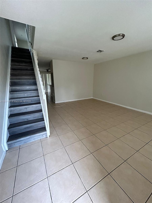 8297 SW 25th Ct Unit 101, Miramar, FL 33025 - stairway featuring tile patterned flooring and baseboards