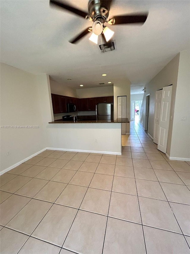 8297 SW 25th Ct Unit 101, Miramar, FL 33025 - unfurnished living room featuring light tile patterned floors, ceiling fan, and recessed lighting