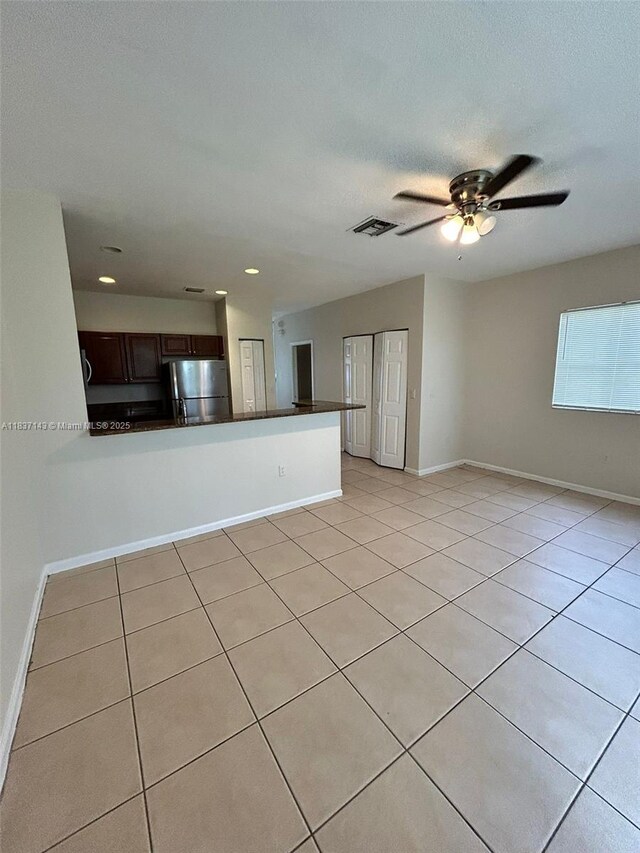 8297 SW 25th Ct Unit 101, Miramar, FL 33025 - unfurnished living room featuring light tile patterned floors, recessed lighting, and a ceiling fan