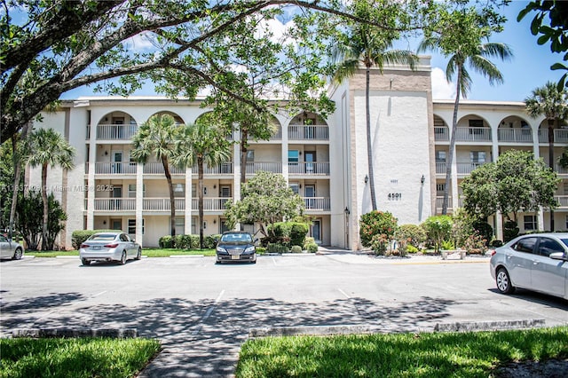 4501 Martinique Way Unit C1, Coconut Creek, FL 33066 - view of apartment building / complex featuring uncovered parking