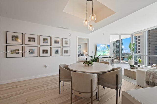 851 NE 1st Ave Unit 2809, Miami, FL 33132 - dining area with light wood-style flooring