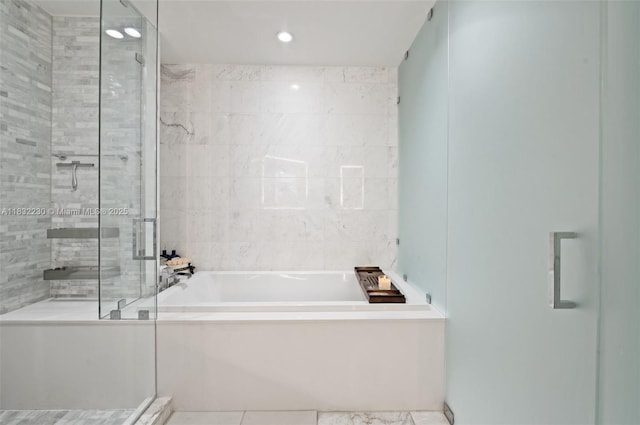 851 NE 1st Ave Unit 2809, Miami, FL 33132 - full bath with a shower stall, a garden tub, and recessed lighting