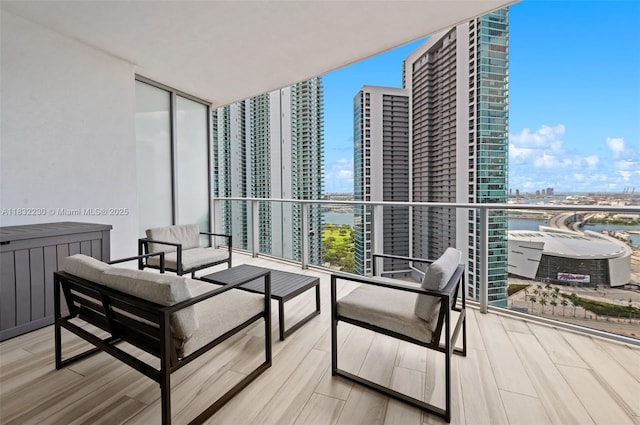 851 NE 1st Ave Unit 2809, Miami, FL 33132 - balcony with a view of city, a water view, radiator, and an outdoor hangout area