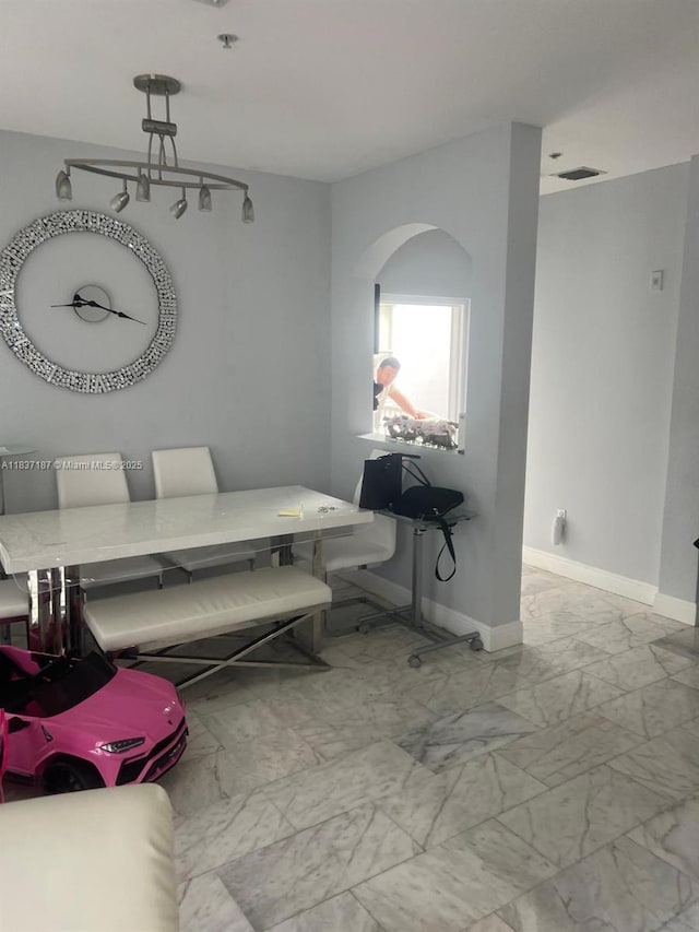4301 SW 160th Ave Unit 215, Miramar, FL 33027 - interior space featuring marble look tile flooring and arched walkways