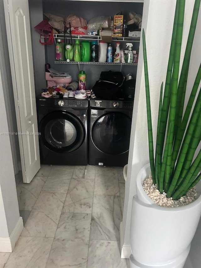 4301 SW 160th Ave Unit 215, Miramar, FL 33027 - washroom featuring marble look tiles and separate washer and dryer