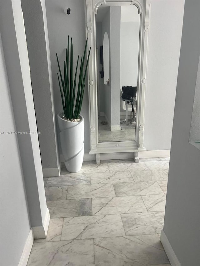 4301 SW 160th Ave Unit 215, Miramar, FL 33027 - corridor with marble finish floors and arched walkways