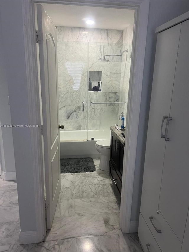 4301 SW 160th Ave Unit 215, Miramar, FL 33027 - full bathroom with marble look tiles, shower / bath combination with glass door, and vanity