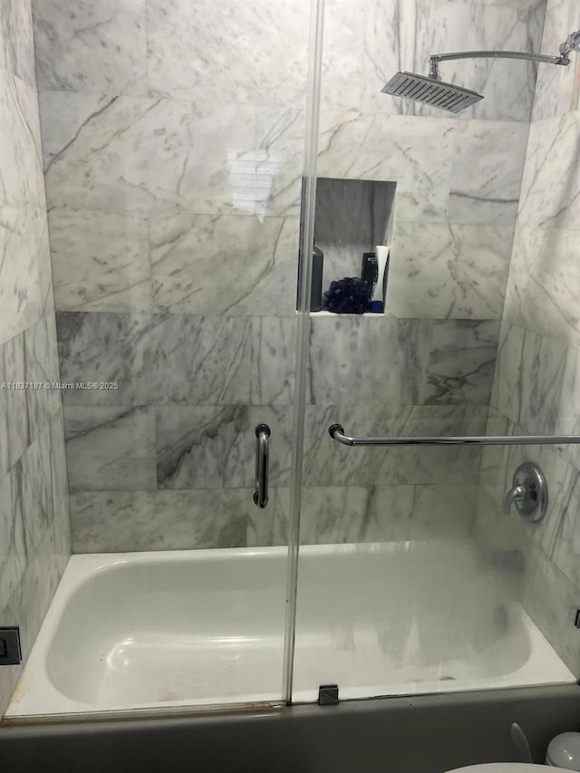 4301 SW 160th Ave Unit 215, Miramar, FL 33027 - bathroom with shower / bath combination with glass door and toilet